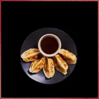 Wagamama Chicken Gyoza — crispy fried chicken dumplings served with savoury dipping sauce.