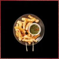 Wagamama Chilli Squid — crispy squid rings with red chillies, coriander, and dipping sauce.