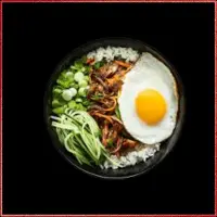 Wagamama Duck Donburi — shredded duck in rich plum sauce with steamed rice and spring onions.